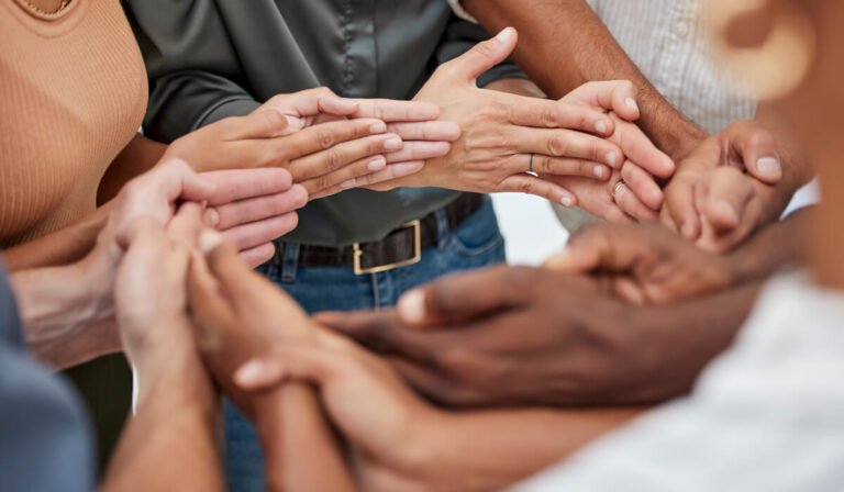 Hands joined together in support